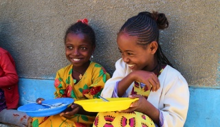 Two girls laughing together